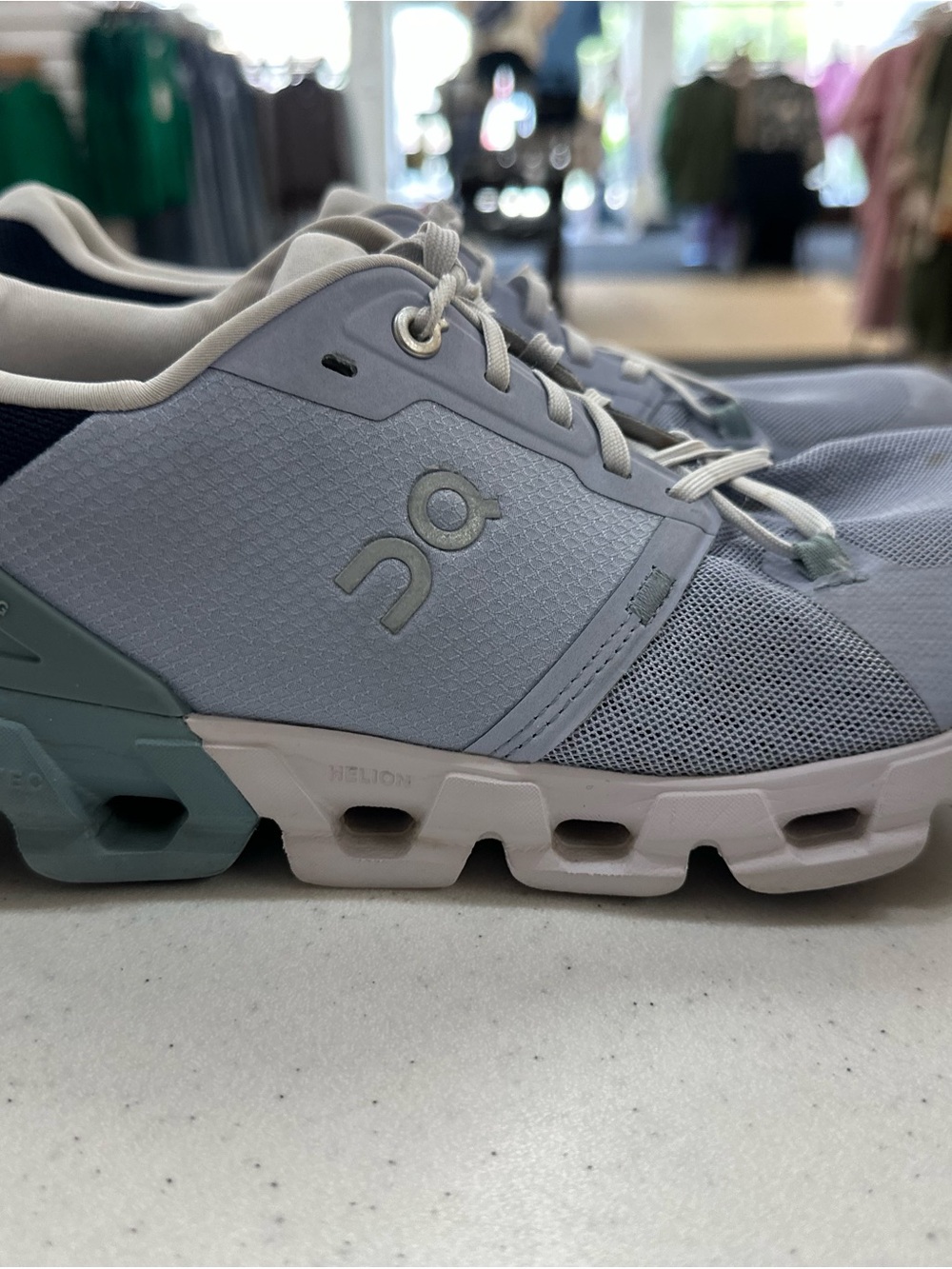 Women's On Cloudflyer 4 running shoes in the Nimbus/Cobble colorway